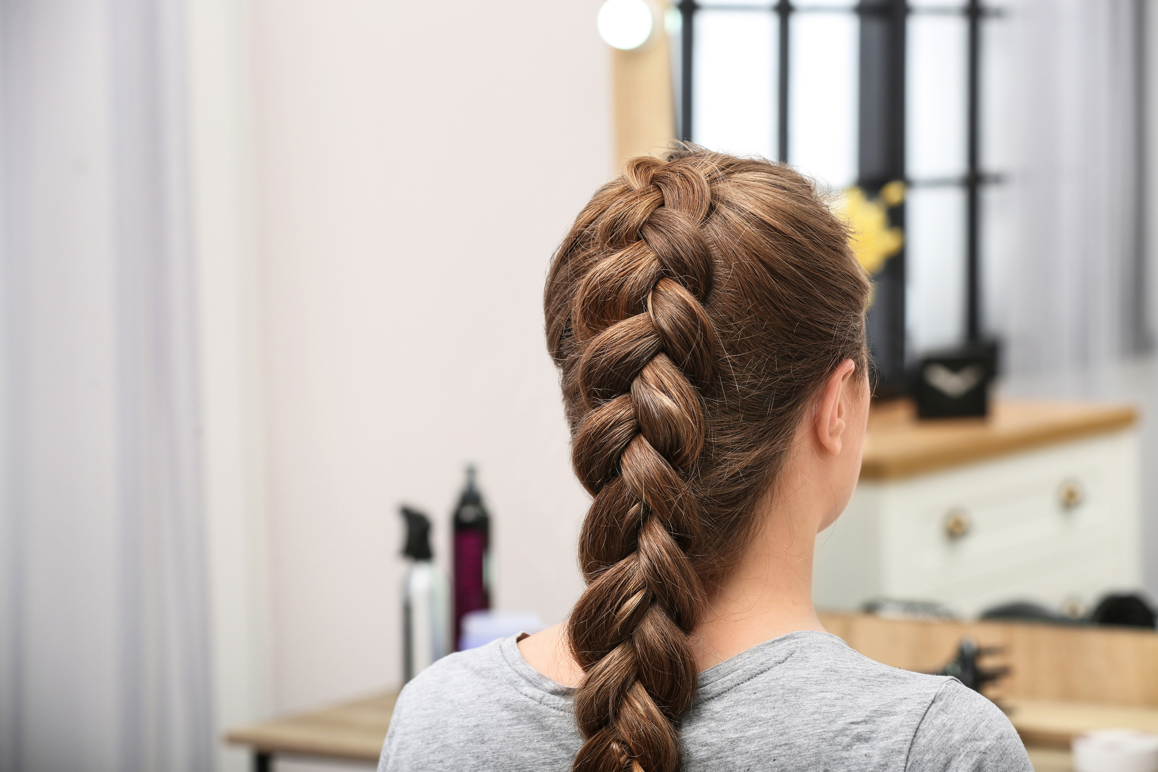 Woman with Braided Hair in Professional Salon